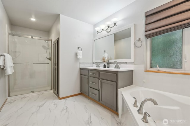 full bath with a shower stall, marble finish floor, double vanity, a sink, and a bath
