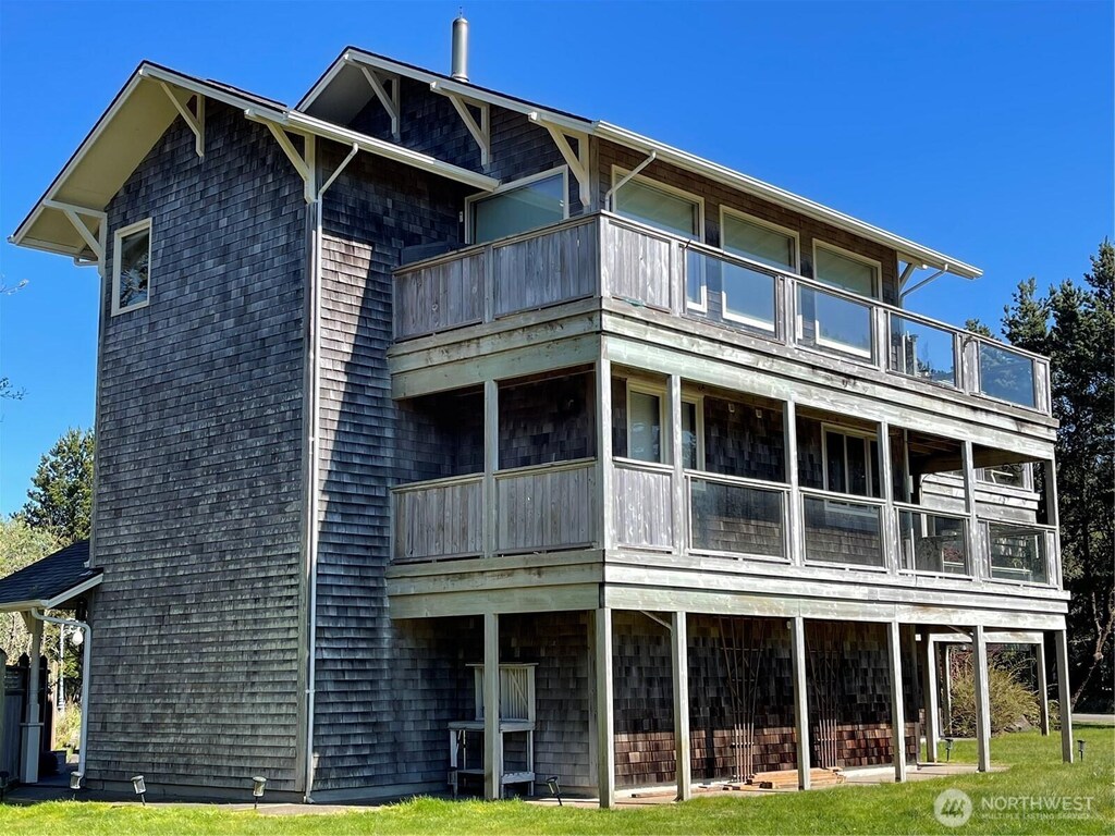 rear view of house featuring a balcony