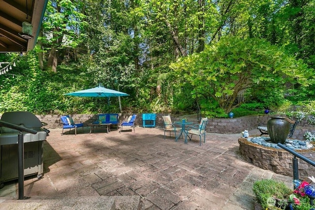 view of patio featuring an outdoor living space and grilling area