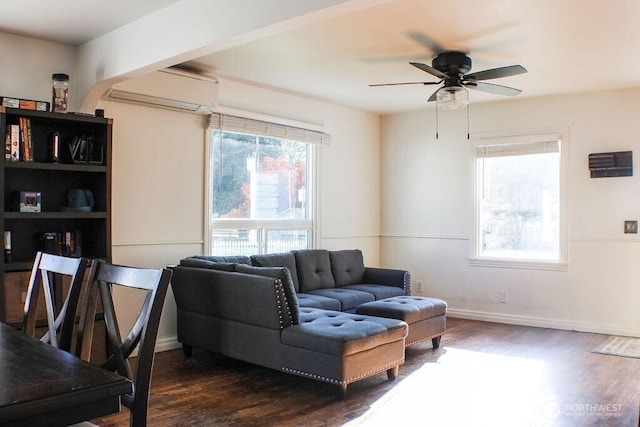 2916 Robin Ave, Bremerton, WA 98310 - living area with dark wood-type flooring, plenty of natural light, ceiling fan, and a wall mounted air conditioner