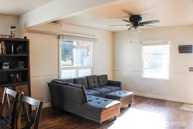 2916 Robin Ave, Bremerton, WA 98310 - living room with dark wood finished floors, arched walkways, baseboards, a wall mounted AC, and ceiling fan