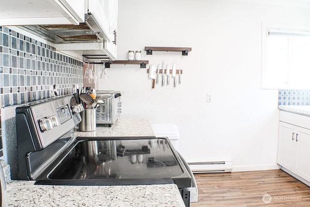 2916 Robin Ave, Bremerton, WA 98310 - kitchen with baseboard heating, tasteful backsplash, stainless steel range with electric cooktop, light countertops, and white cabinetry