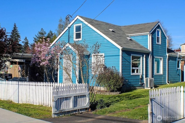 2916 Robin Ave, Bremerton, WA 98310 - bungalow-style house with cooling unit, roof with shingles, and fence