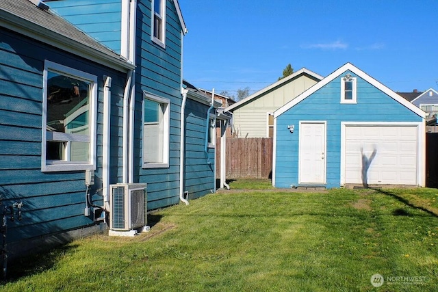 2916 Robin Ave, Bremerton, WA 98310 - exterior space with fence, a detached garage, an outbuilding, and central AC