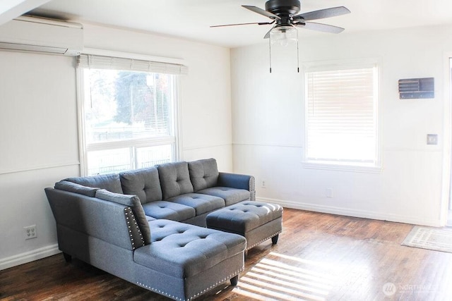 2916 Robin Ave, Bremerton, WA 98310 - living area featuring baseboards, wood finished floors, a wall unit AC, and ceiling fan