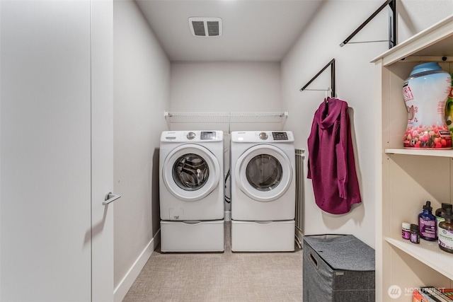 laundry room featuring carpet, visible vents, laundry area, and independent washer and dryer
