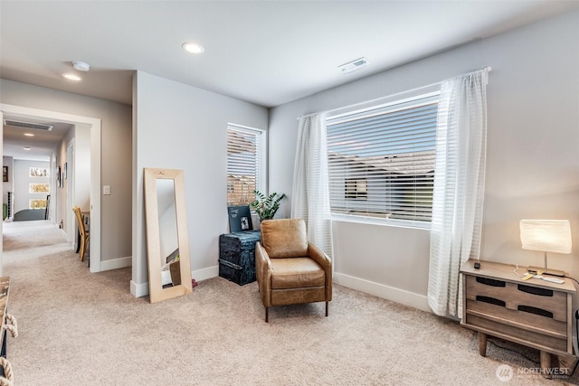living area featuring recessed lighting, carpet floors, visible vents, and baseboards