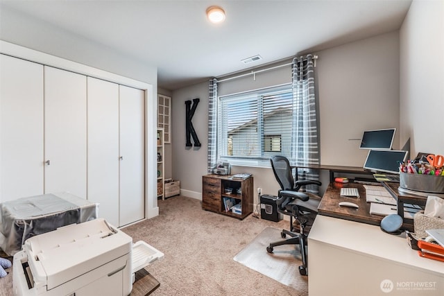 carpeted home office featuring baseboards and visible vents