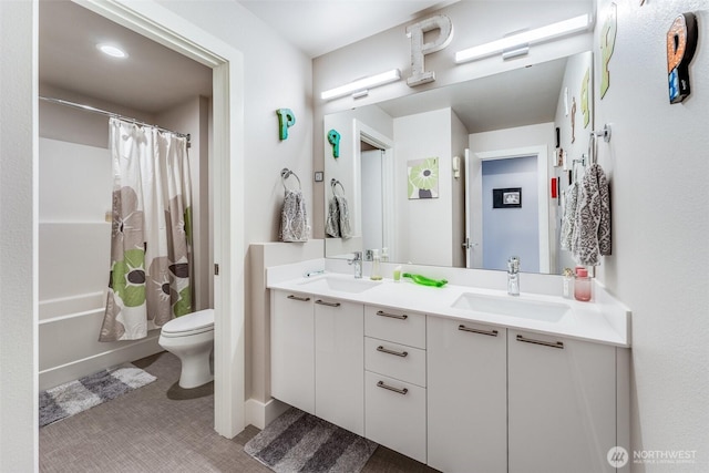 full bath with shower / bath combination with curtain, double vanity, toilet, and a sink
