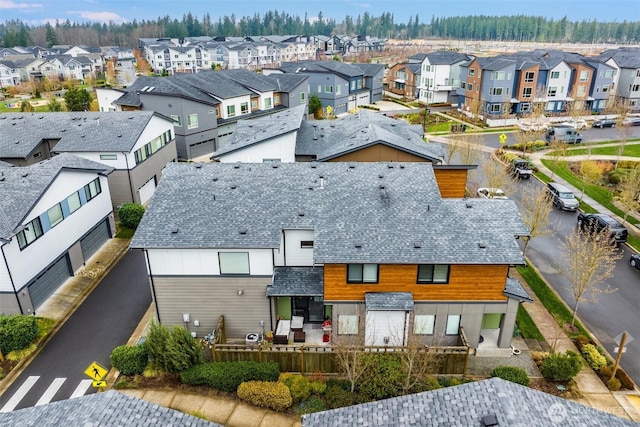birds eye view of property with a residential view