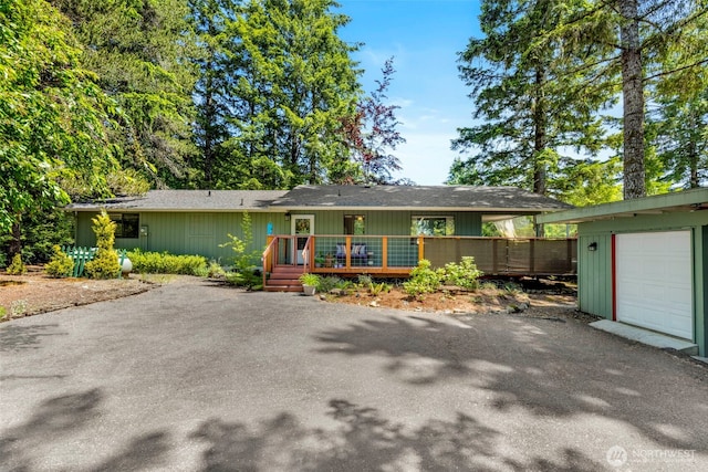 131 E Vine Maple Ln, Union, WA 98592 - single story home featuring driveway, a deck, and a garage