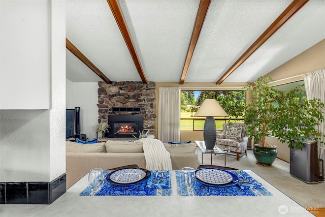 131 E Vine Maple Ln, Union, WA 98592 - living area featuring a fireplace and a textured ceiling