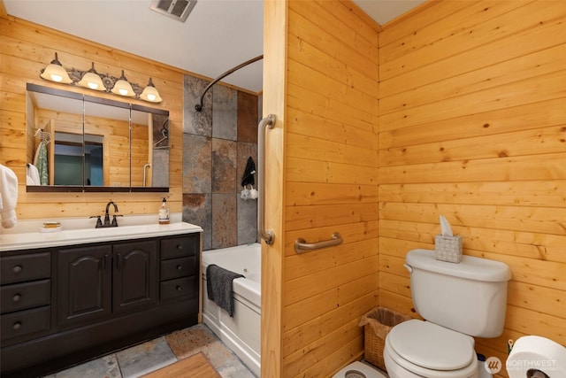 131 E Vine Maple Ln, Union, WA 98592 - bathroom featuring toilet, vanity, shower / bath combination, and wooden walls