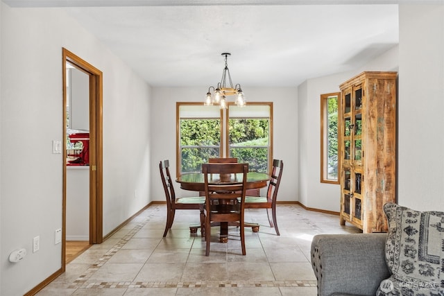 327 Keach Ct, Steilacoom, WA 98388 - dining space featuring baseboards, a chandelier, and light tile patterned flooring