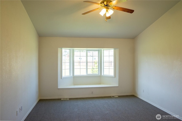 61 Stacey Ct, Sequim, WA 98382 - empty room with dark colored carpet, ceiling fan, and baseboards