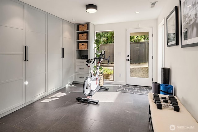 workout room with baseboards and recessed lighting
