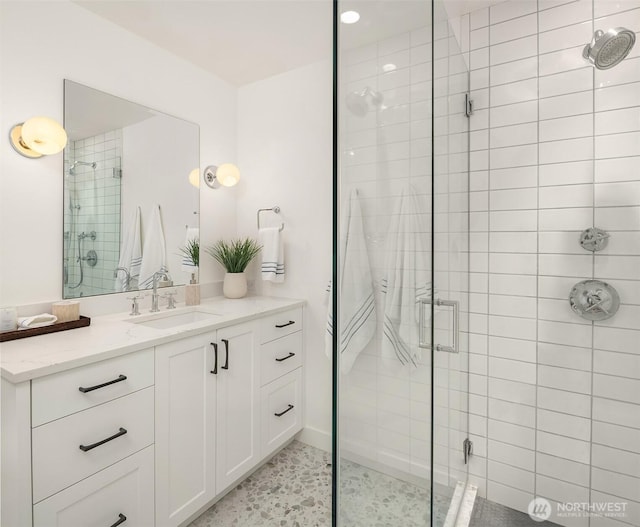 bathroom featuring a stall shower and vanity