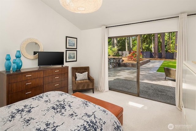 carpeted bedroom featuring access to exterior and lofted ceiling