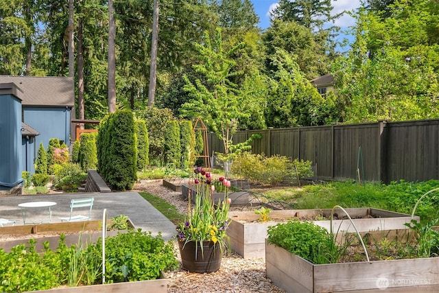 view of yard featuring a garden and fence