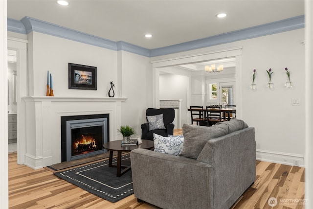 119 37th Ave E, Seattle, WA 98112 - living area with baseboards, a lit fireplace, wood finished floors, and recessed lighting