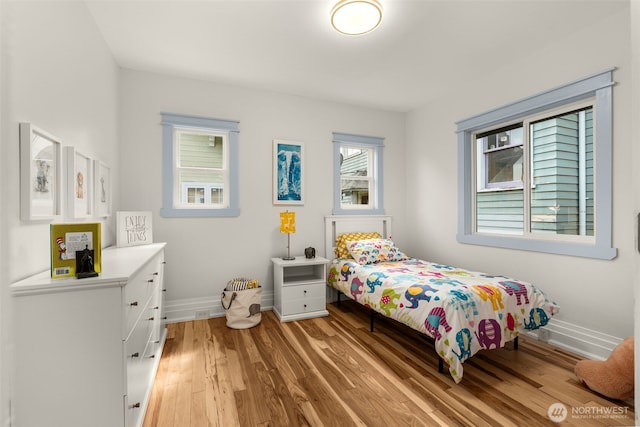 119 37th Ave E, Seattle, WA 98112 - bedroom with light wood finished floors and baseboards