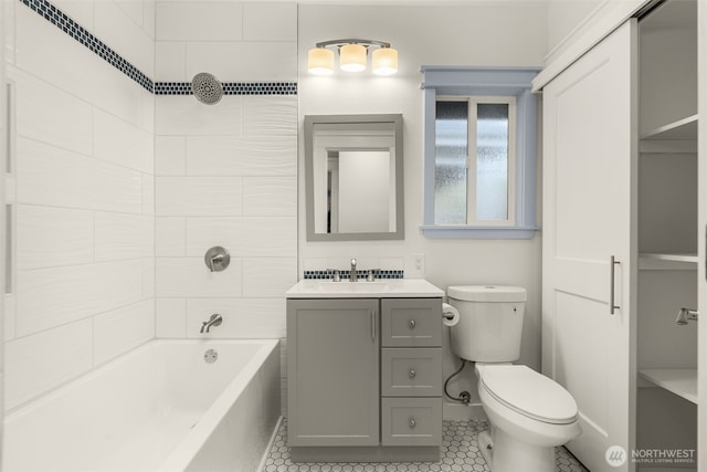 119 37th Ave E, Seattle, WA 98112 - full bath featuring tile patterned flooring, toilet, vanity, and  shower combination