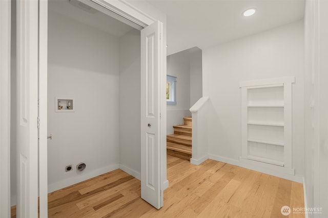 119 37th Ave E, Seattle, WA 98112 - laundry room with light wood-style floors, built in shelves, baseboards, laundry area, and washer hookup