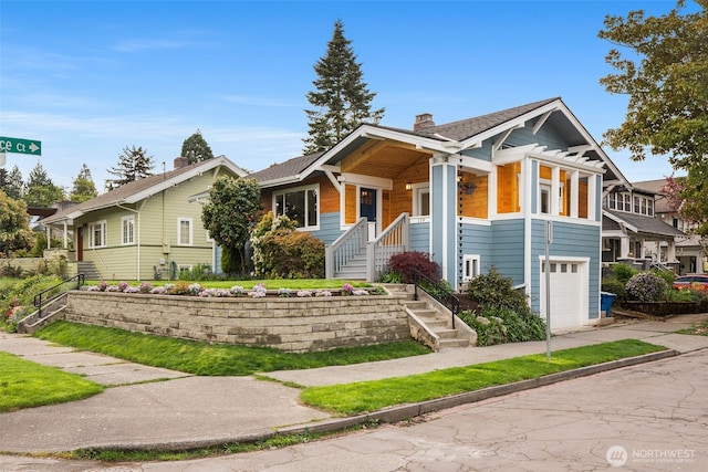 119 37th Ave E, Seattle, WA 98112 - view of front of house featuring a chimney, driveway, and a garage