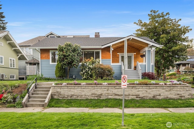 119 37th Ave E, Seattle, WA 98112 - view of front of property featuring a shingled roof and a chimney