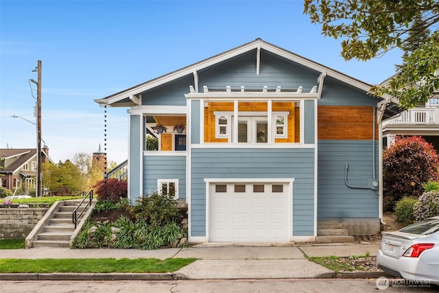 119 37th Ave E, Seattle, WA 98112 - view of front of home featuring an attached garage, driveway, and stairs