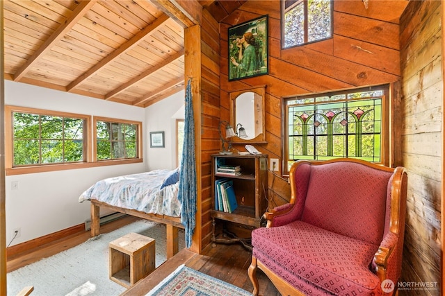 bedroom featuring wood ceiling, wood finished floors, baseboards, lofted ceiling with beams, and wooden walls