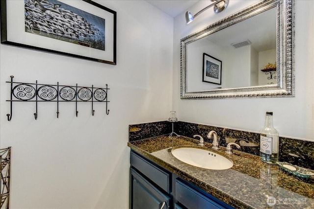 bathroom with visible vents and vanity