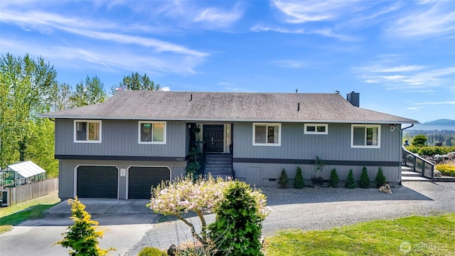 4353 Gooding Ave, Bellingham, WA 98226 - ranch-style house with concrete driveway, fence, an attached garage, and a chimney