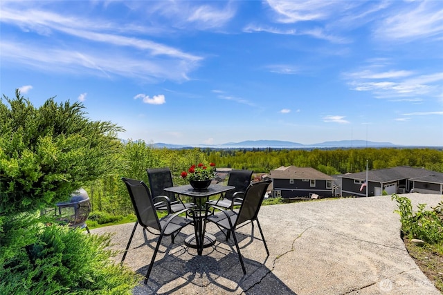 4353 Gooding Ave, Bellingham, WA 98226 - view of patio with a mountain view, driveway, and outdoor dining space