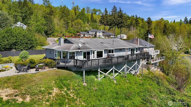 4353 Gooding Ave, Bellingham, WA 98226 - rear view of property featuring a patio, fence, a wooden deck, and a chimney