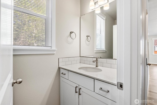 bathroom with backsplash and vanity