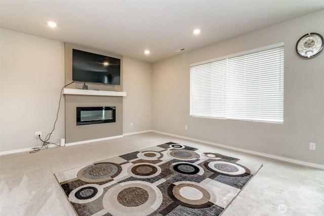 19825 152nd Street Ct SE, Bonney Lake, WA 98391 - carpeted living area with recessed lighting, a glass covered fireplace, and baseboards
