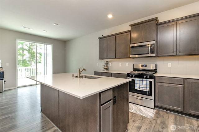 19825 152nd Street Ct SE, Bonney Lake, WA 98391 - kitchen with light wood-style flooring, stainless steel appliances, light countertops, and a sink