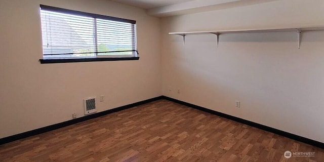1953 S I St Unit 9, Tacoma, WA 98405 - unfurnished room featuring baseboards, visible vents, and wood finished floors
