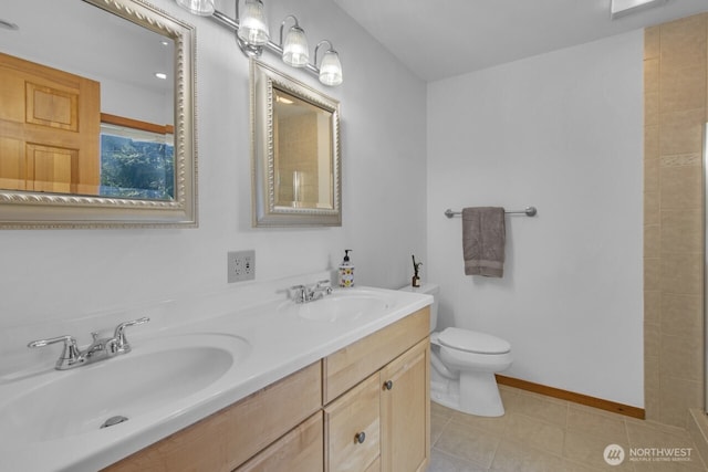 full bathroom featuring toilet, tile patterned flooring, double vanity, and a sink