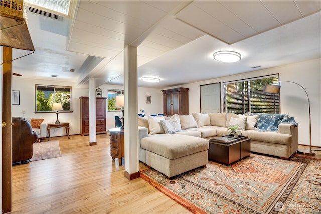 living area with light wood finished floors and visible vents