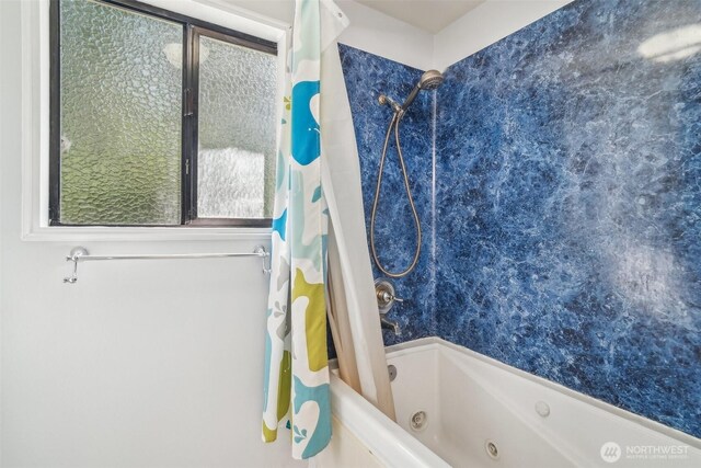 bathroom featuring a combined bath / shower with jetted tub