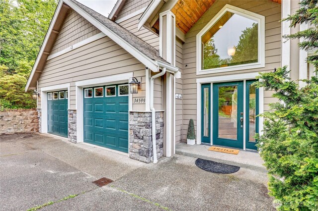 garage with concrete driveway