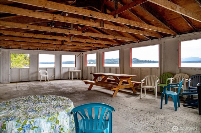 sunroom / solarium with a water view