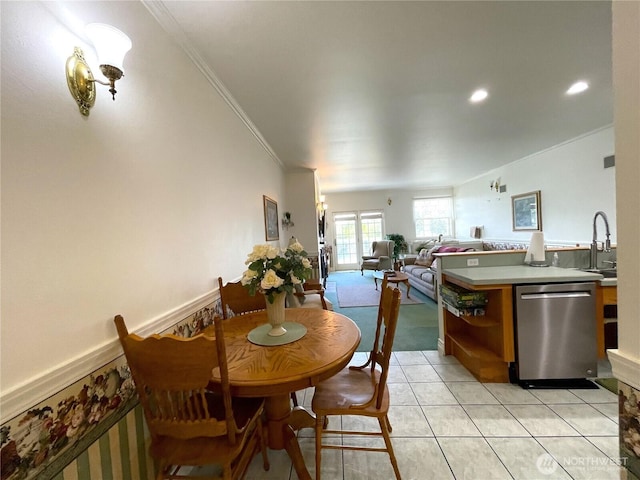 dining area featuring crown molding, light tile patterned flooring, and recessed lighting