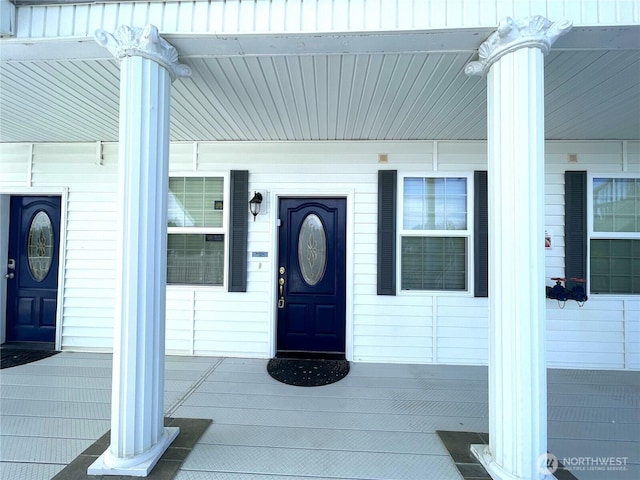 property entrance featuring covered porch