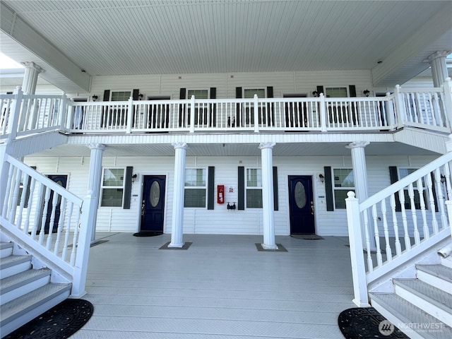 exterior space with covered porch and stairway