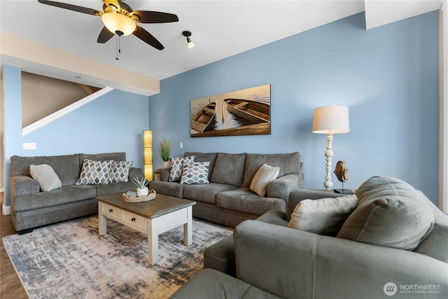 living area featuring ceiling fan and wood finished floors