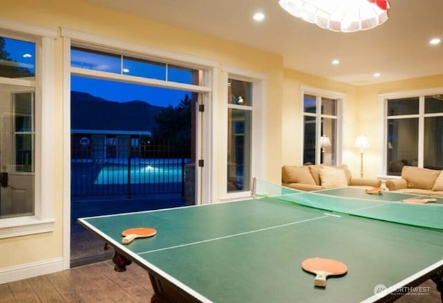 rec room with baseboards, wood finished floors, and recessed lighting