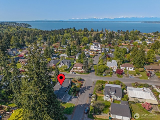 bird's eye view with a residential view and a water view